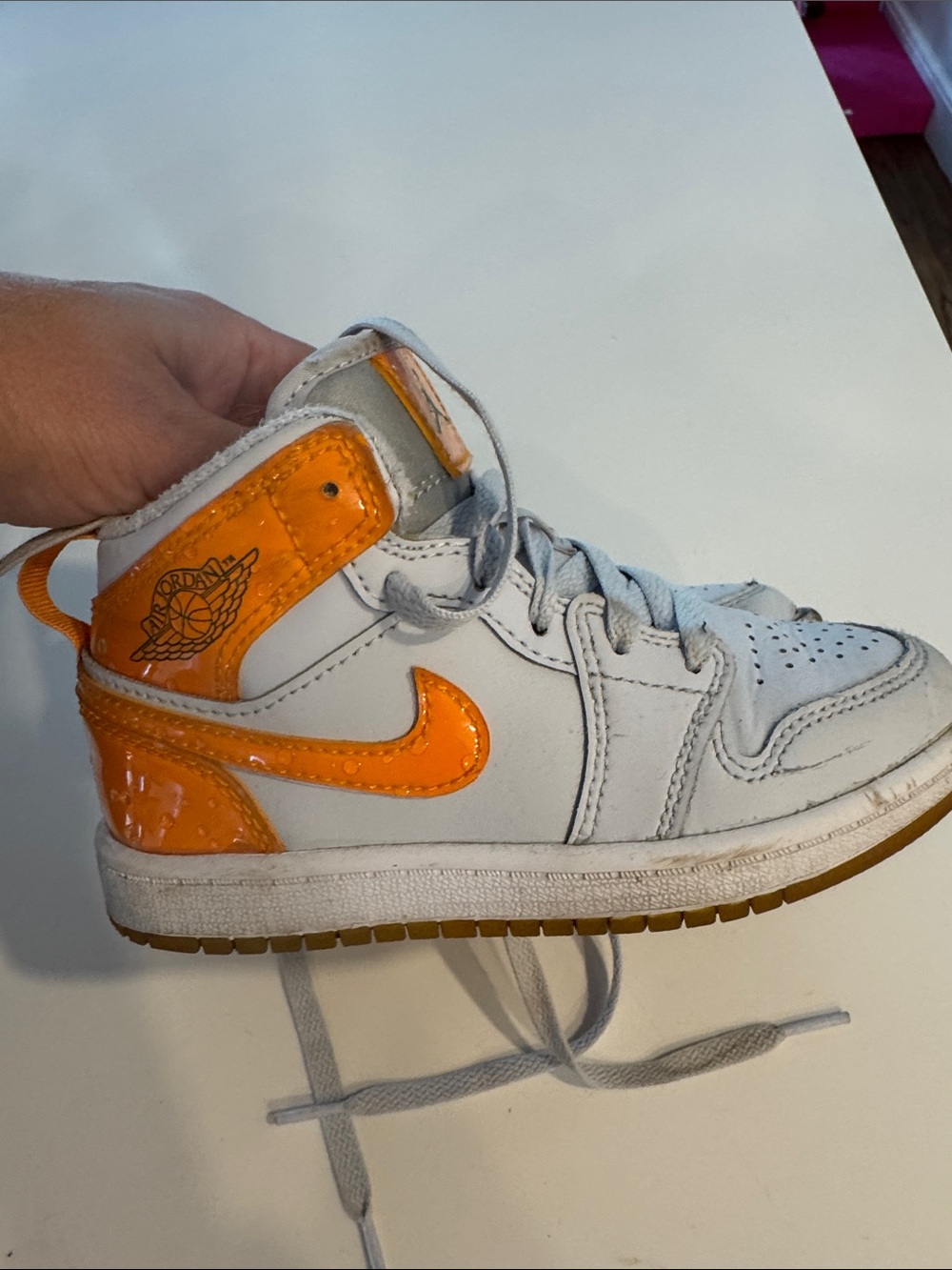 Jordan Kids High-Top Sneaker in White and Orange Patent